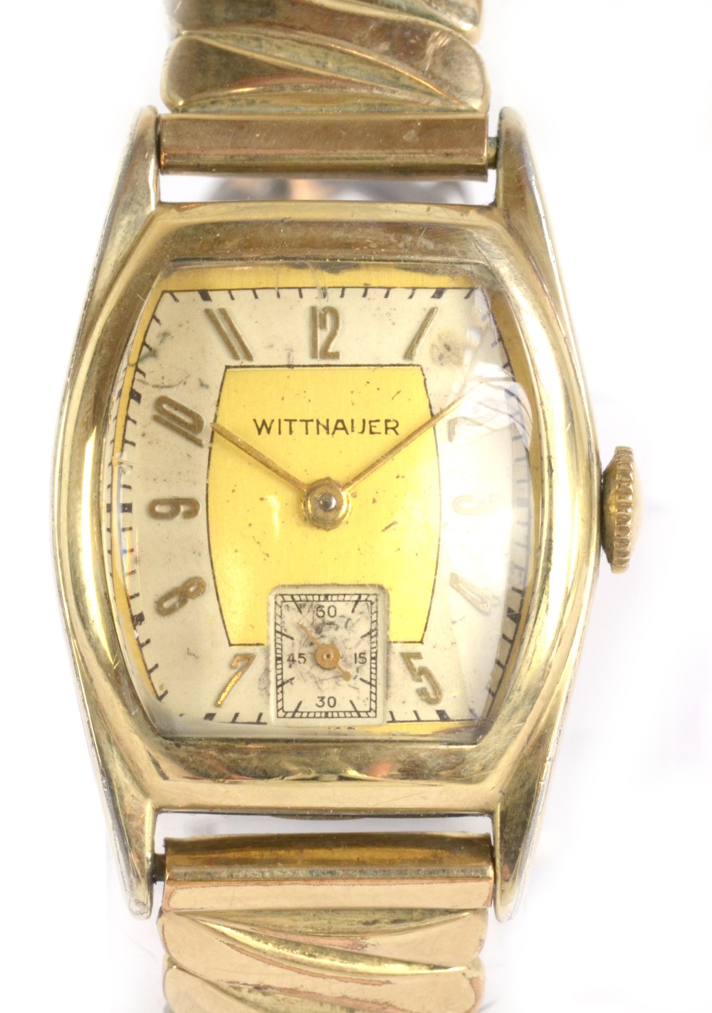 LONGINES-WITTNAUER; a 1940s gold plated and stainless steel wristwatch with tonnaeu case set with