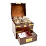 A 19th century doctor or chemist's travelling set housed in brass bound mahogany campaign case,