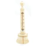 A late 19th century carved ivory thermometer, height 17cm (af).