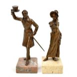 A pair of early 20th century bronzed figures of lady and gentleman on square section stone bases,