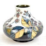 MOORCROFT; a 'Bramble' pattern vase of squat form, impressed marks and WM monogram to base, second