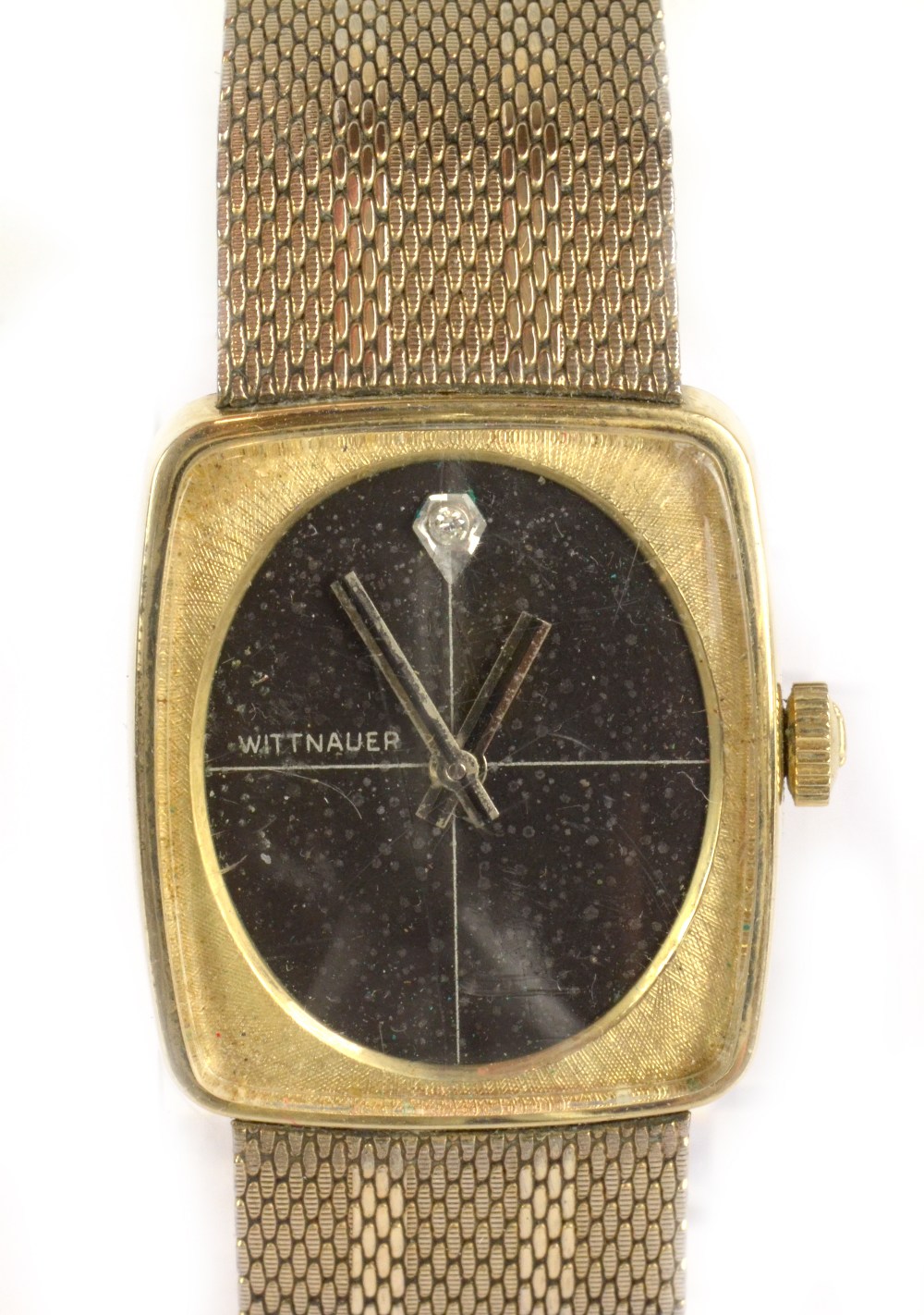 LONGINES-WITTNAUER; a 1970s wristwatch with oval dial set with diamond, integral bracelet and