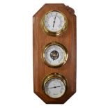 ROBERT THOMPSON OF KILBURN; a 'Mouseman' weather centre set with brass cased thermometer,