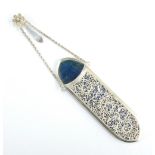 A white metal filigree work lorgnette case with blue silk and velvet lined interior on chain with