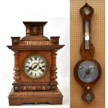 A 19th century rosewood wheel barometer, length 94cm, also a late 19th/early 20th century carved