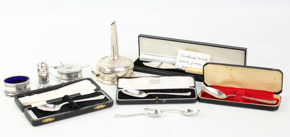 DOCKER & BURNE LTD; a George V hallmarked silver three piece cruet set with pierced Greek Key