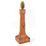 ROBERT THOMPSON OF KILBURN; a 'Mouseman' oak table lamp with carved mouse on square section base,