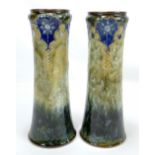 ROYAL DOULTON; a large pair of stoneware vases with stylised floral decoration on a mottle green