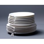 CAROLINE TATTERSALL; a stack of six saucers and six side plates, cast porcelain with distressed