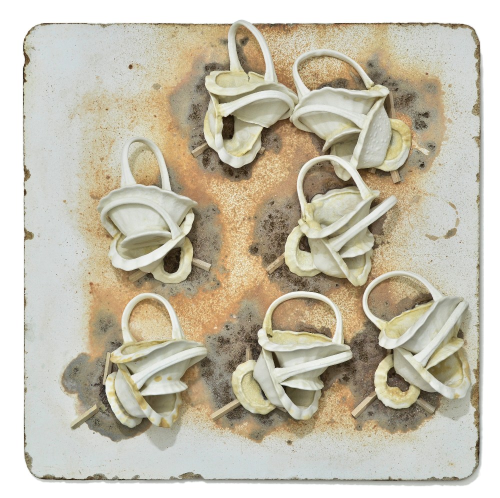 NEIL BROWNSWORD (born 1970); Waster I (2011), a stoneware wall hanging (with metal brackets), 45 x