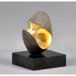 MATT SHERRATT (born 1969); 'Radiant', carved black clay with 24ct gold leaf mounted on granite base,