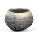 PATRICIA SHONE (born 1962); a small stoneware vessel, fractured and textured surface, height 9cm. (