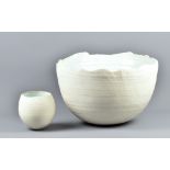 A large deep stoneware bowl with way rim covered in matt white glaze, impressed S mark, diameter