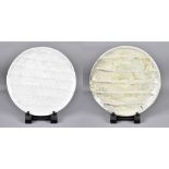 AKIKO HIRAI (born 1970); a near pair of ribbed stoneware plates covered in pale green ash and