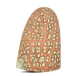 BEN ARNUP (born 1954); a stoneware axe head form, fractured surface partially covered in turquoise