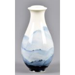 RICHARD HEELEY; a porcelain bottle with cobalt landscape decoration, impressed RH and painted