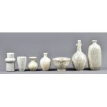 PAT HIGGINBOTHAM (1928-2010); a group of porcelain bottles, vases and bowls covered in white crackle