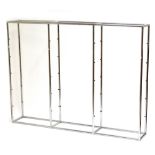 A mid-century tubular chrome display shelf with twelve glass shelves, height 183cm, length 247cm,