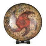 ABDO NAG1 (1941-2001); a stoneware charger covered in mottled glaze with red Catherine wheel style