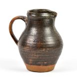 Attributed to HEBER MATHEWS (1907-1959); a stoneware jug, iron glaze with iron decoration, incised