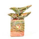 IAN GREGORY (born 1942); a small salt glazed sculpture of a pair of birds on a rectangular base,