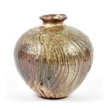 ALEX SHIMWELL (born 1980); a stoneware textured vase covered in shino and ash glaze with iron and