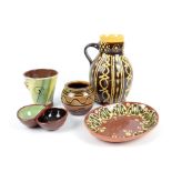 JOHN HUDSON (born 1946); a slipware jug and dish, impressed H marks, jug height 21.5cm, and other