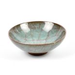 A small stoneware footed dish covered in crystalline glaze, impressed mark (possibly SUI),