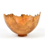 BERT MARSH (1932-2011); a burr walnut footed bowl with irregular rim, incised mark, diameter