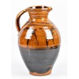 CLIVE BOWEN (born 1943); a slipware jug partially covered in honey glaze, height 34cm. (D)Additional