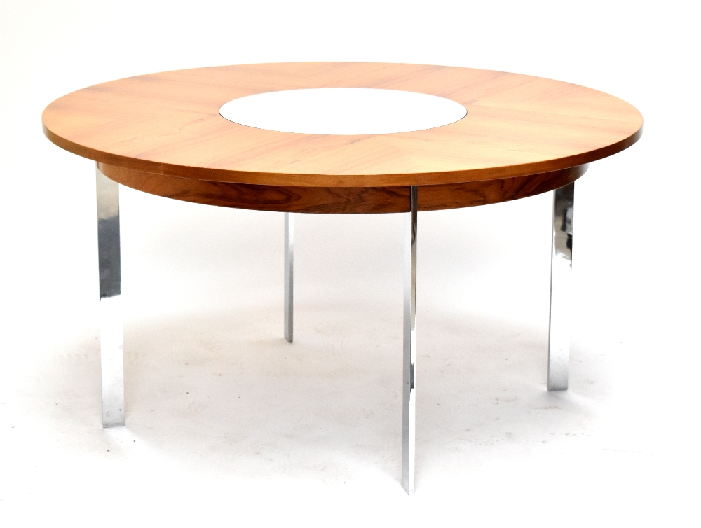 RICHARD YOUNGER FOR MERROW ASSOCIATES; a rosewood and chrome dining table of circular form, with