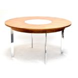 RICHARD YOUNGER FOR MERROW ASSOCIATES; a rosewood and chrome dining table of circular form, with