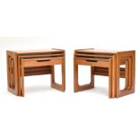 A pair of mid-century teak nest of three graduated coffee tables, each with central drawer to bottom