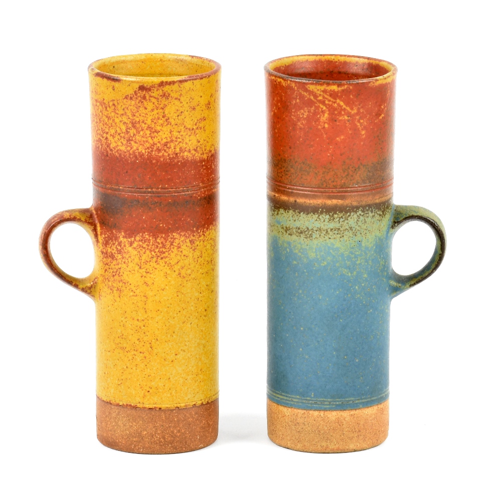 ROBIN WELCH (born 1936); a pair of tall stoneware mugs, impressed marks, height 18cm (2). (D)