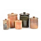 Muchelney Pottery; five stoneware jars and covers including a preserve jar and garlic jar, impressed