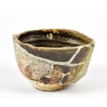 CHARLES BOUND (born 1939); a wood fired chawan with white slip, impressed marks, diameter 13cm.