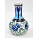 WILLIAM DE MORGAN; a Persian inspired vase with five stylised tulips painted in blue on a cream