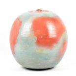 ABDO NAG1 (1941-2001); a large globular stoneware vessel covered in pinkish red and blue/grey glaze,