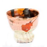 SIMON CARROLL (1964-2009); a slip decorated earthenware tea bowl, painted SC mark and dated 2005,