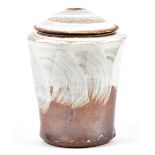 TIM LAKE (born 1974); a stoneware jar and cover, white and red slip and thin shino-type glaze,