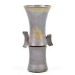 PHIL MUMFORD (born 1945); a tall lugged stoneware vase covered in matt mauve glaze with incised