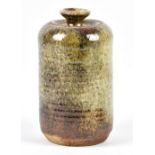 ROSEMARY WREN (1922-2013) for Oxshott Pottery; a stoneware jar and cover with ribbed body, impressed