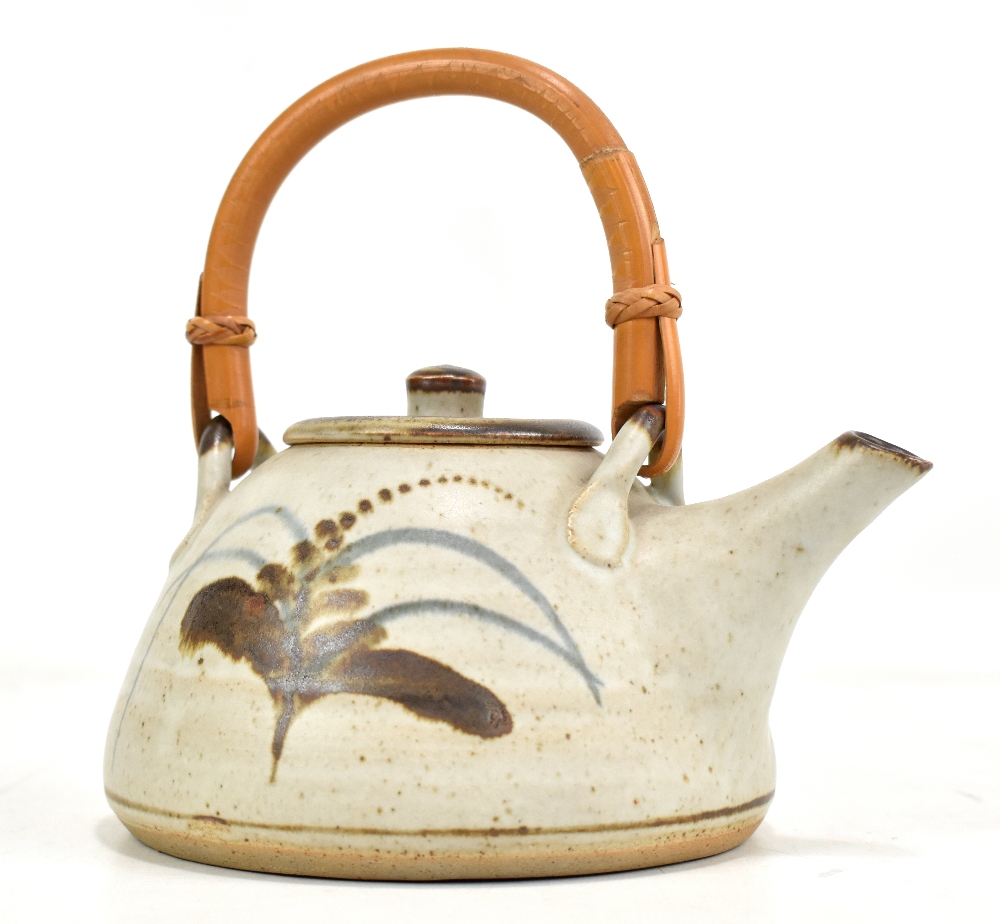 Lowerdown Pottery; a stoneware teapot with cane handle, foxglove decoration on pale grey ground,
