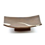 JANET LEACH (1918-1997) for Leach Pottery; a rectangular stoneware slab dish raised on a pedestal,