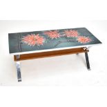 A chromed rectangular coffee table with floral motif tiled top, indistinctly signed or marked to one