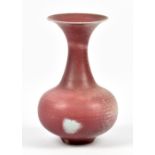 VIVIENNE FOLEY; a porcelain vase covered in mottled fuchsia glaze, impressed mark, height 26cm. (