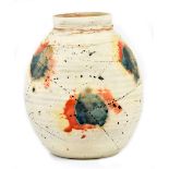 JOHN KERSHAW (born 1940); an ovoid stoneware vase with pronounced ribbing and polychrome decoration,