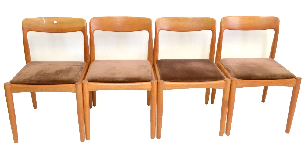 A set of four 1960s teak framed dining chairs raised on column supports, height 77cm (4).