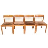 A set of four 1960s teak framed dining chairs raised on column supports, height 77cm (4).