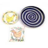 NICOLA WERNER (born 1959); a small earthenware plate and tile decorated with chickens, painted